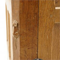 Mouseman - adzed and panelled oak 6' sideboard, fitted with four central drawers and flanking cupboards, enclosed by two panelled doors with wrought metal latches and hinges, on octagonal feet, carved with mouse signature, panelled sides, by the workshop of Robert Thompson, Kilburn 