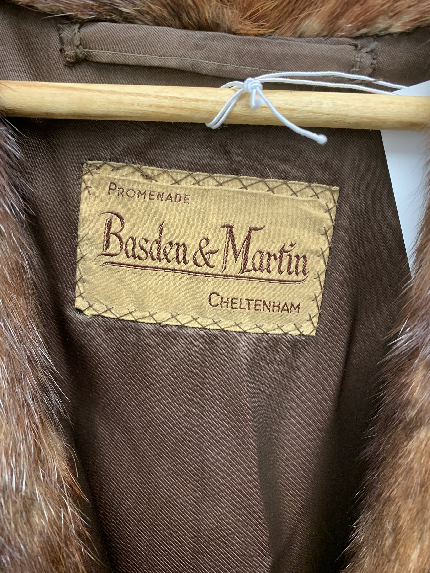 A lined Musquash fur coat. 