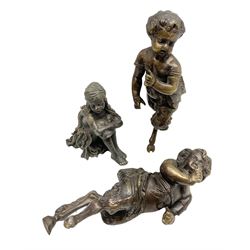 Pair of early 20th century French bronze faun figures modelled as young boys, probably originally from a clock garniture, together with a figure of a young girl sat with her knees tucked, tallest H24cm