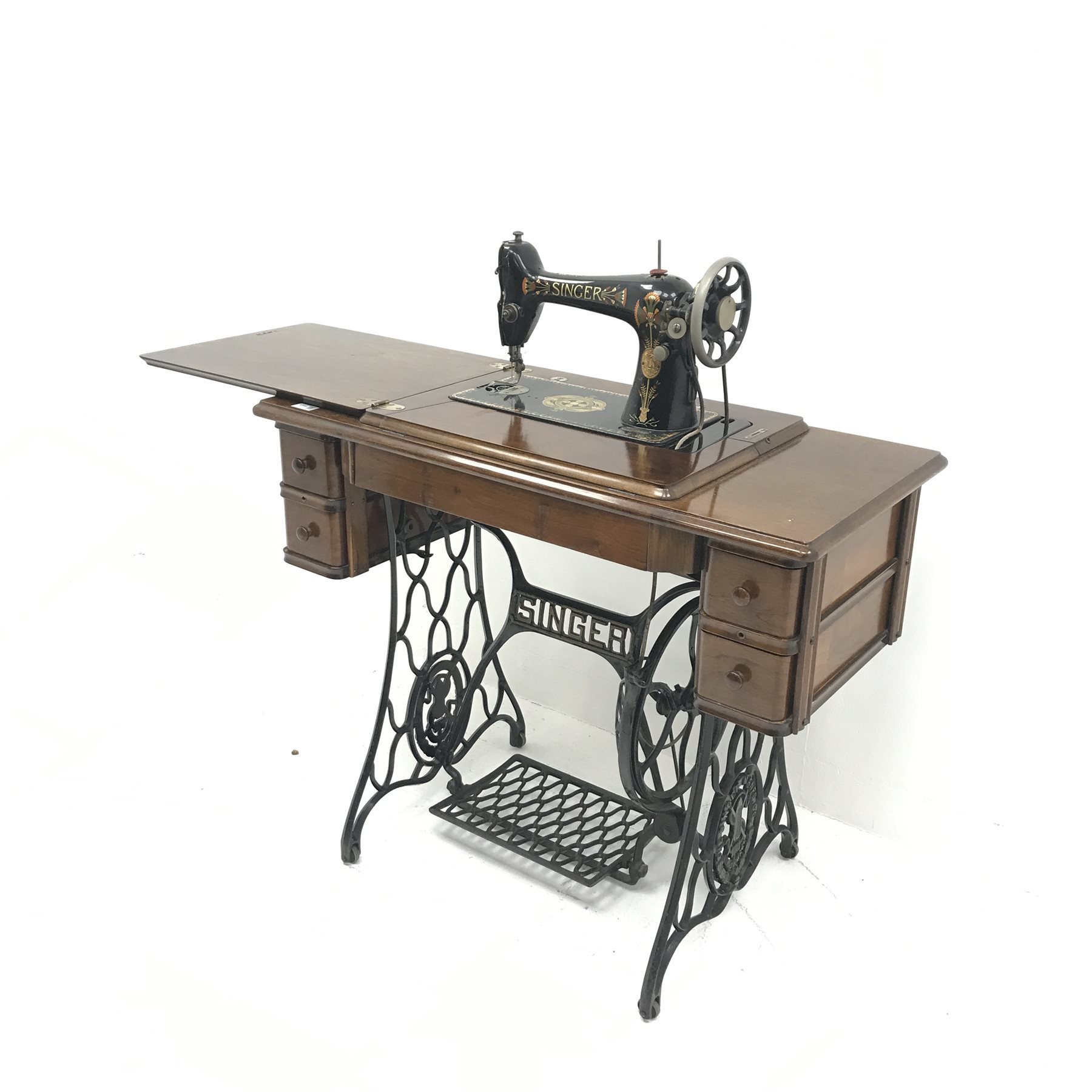 Singer Treadle sewing machine, four drawers, wrought iron base, W91cm