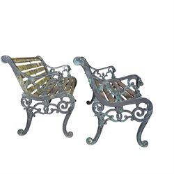Pair of Victorian Revival Coalbrookdale design 'Dog and Serpent' pattern benches with slatted seats, the cast iron end supports of pierced and scrolling design with dog mask arm terminals