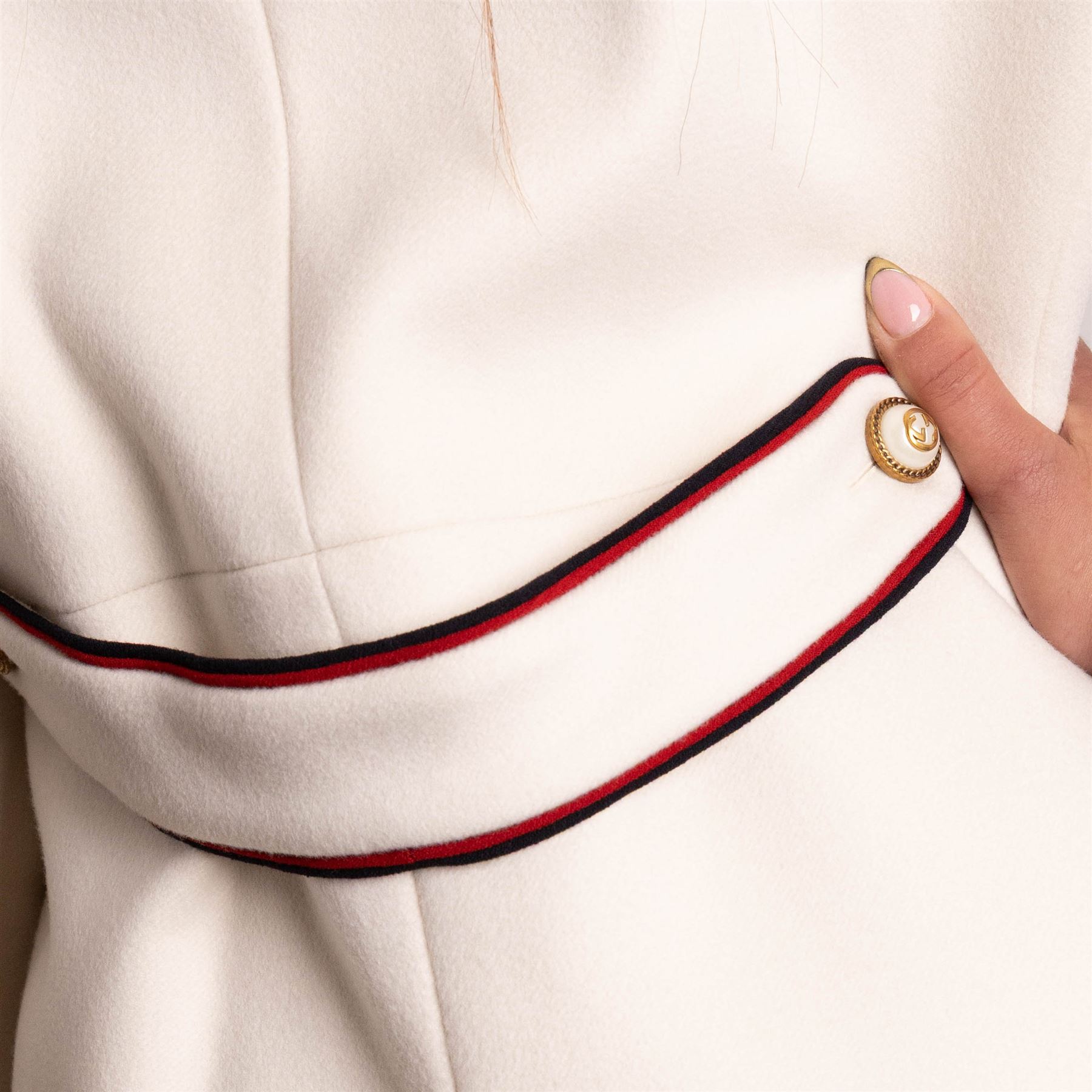 Gucci - bee embroidered wool single-breasted military coat, from the Autumn/Winter 2017 collection under Alessandro Michele, in ivory, with stand collar, red and navy trim, pearlescent and gold-tone button fastening and embroidered bee detailing to the collar, size 14, unused with original garment bag and tags