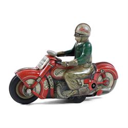 Schuco Curvo 1000 tinplate clockwork motorcycle, in red and cream, with rider in green jacket