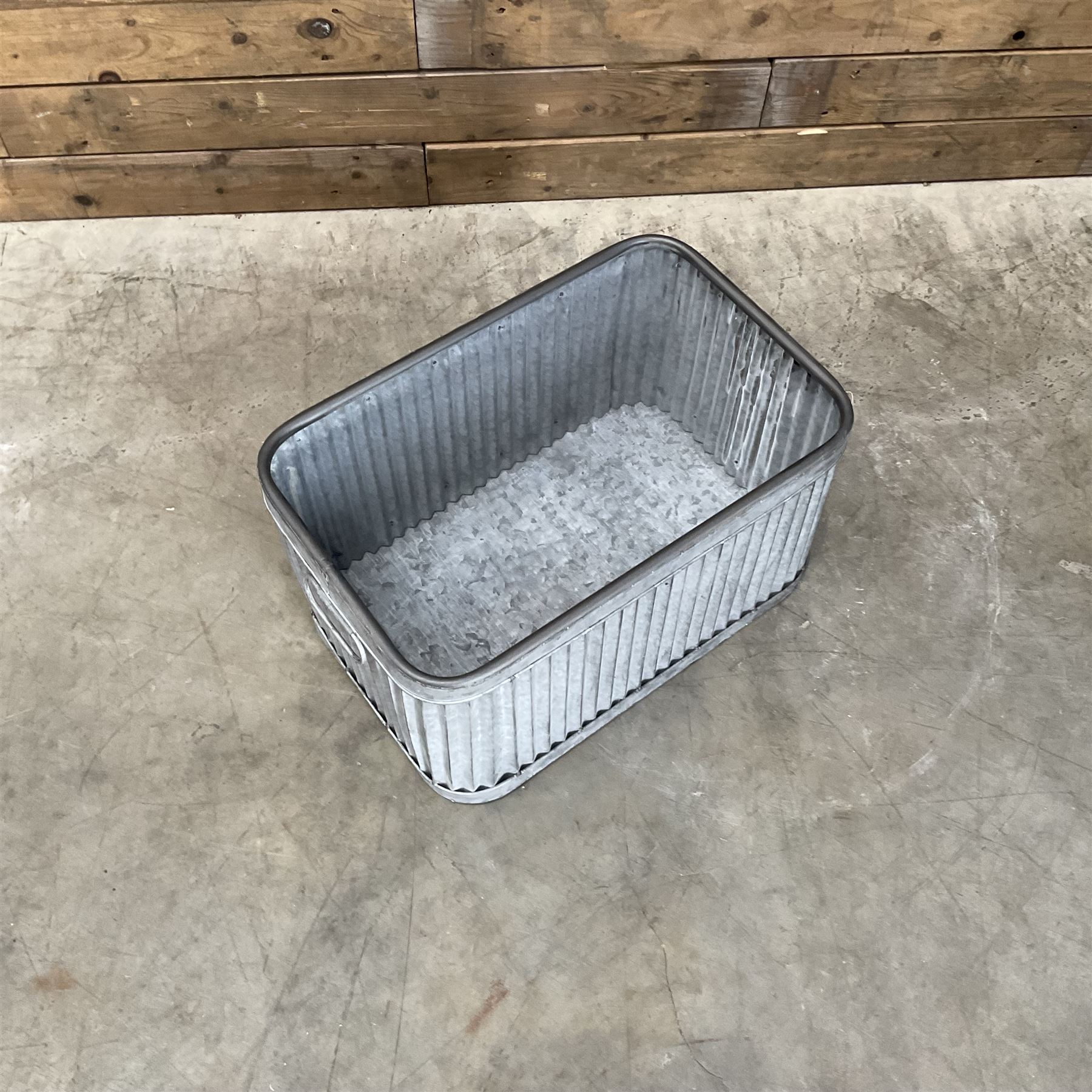 Set of three pressed metal planters in different sizes