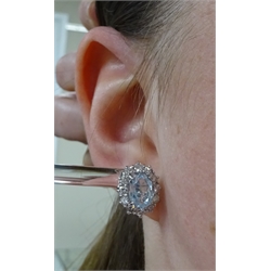  Pair of 18ct white gold aquamarine and diamond cluster earrings hallmarked, aquamarine total weight approx 2.10 carat, diamond total weight approx 1.10 carat  