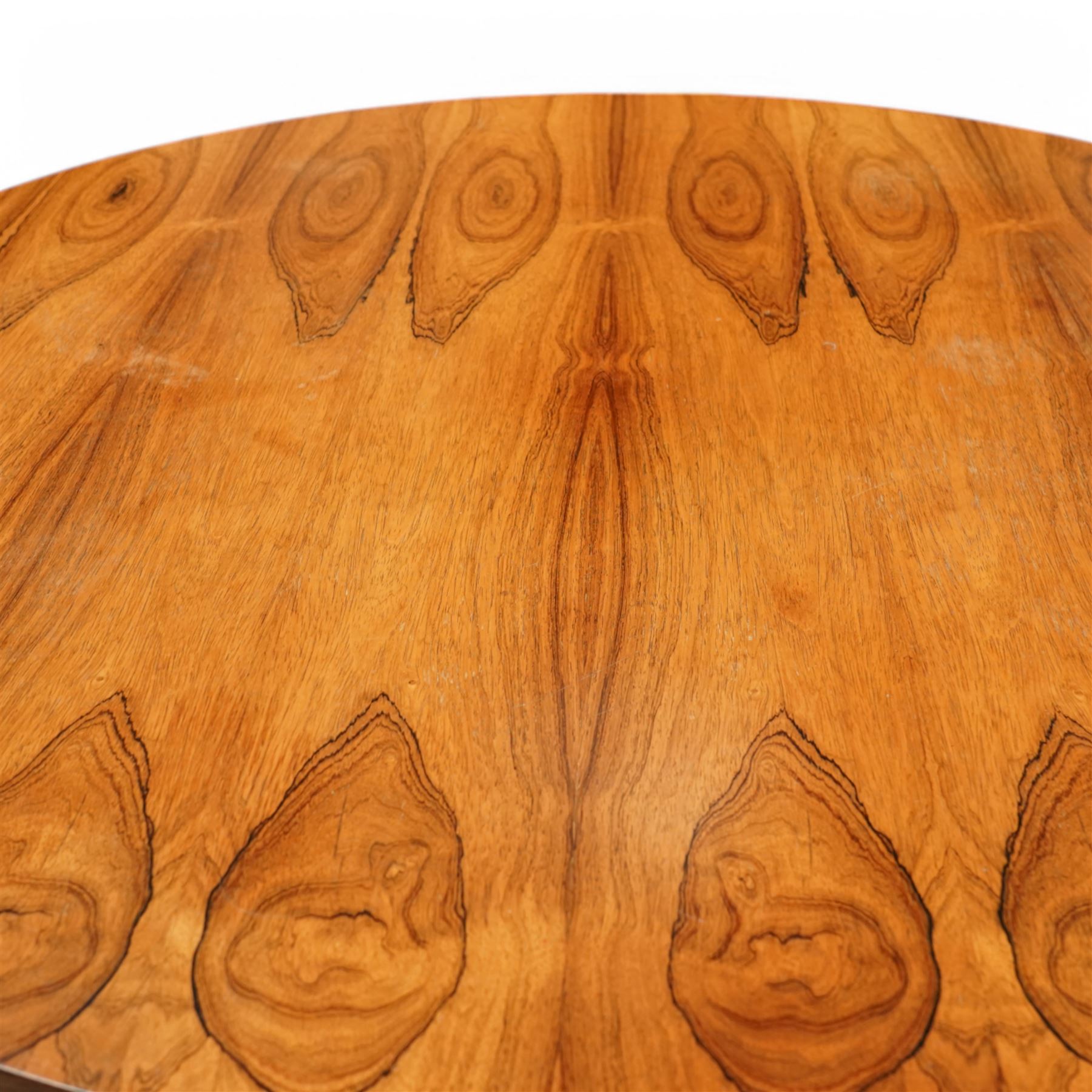 Mid-century Merrow Associates rosewood and chrome dining table, the circular top with striking rosewood veneers, raised on a chromed steel base of eight supports joined by a central ring stretcher