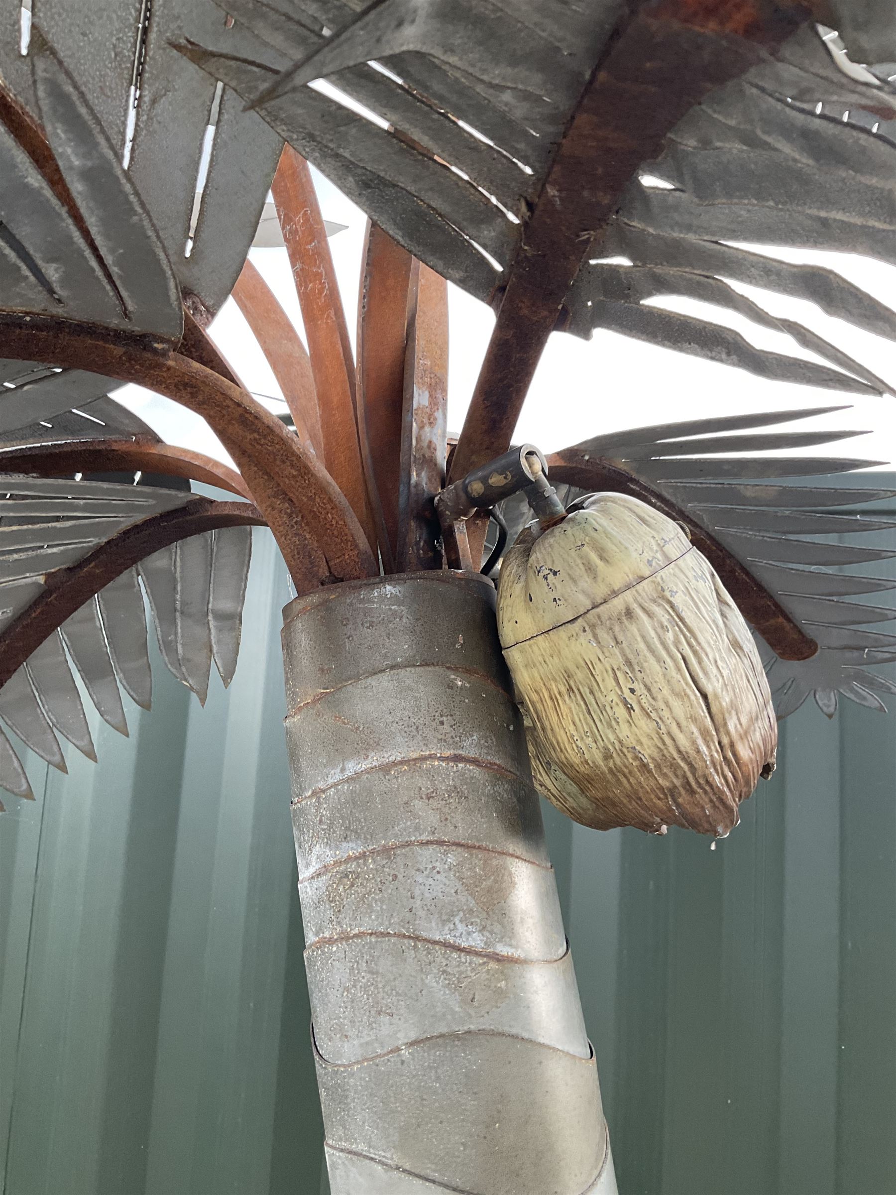 Designer Palms - shaped metal full size palm tree, double curved trunk with large metal fronds and pair of coconut lights, on rectangular base - THIS LOT IS TO BE COLLECTED BY APPOINTMENT FROM DUGGLEBY STORAGE, GREAT HILL, EASTFIELD, SCARBOROUGH, YO11 3TX