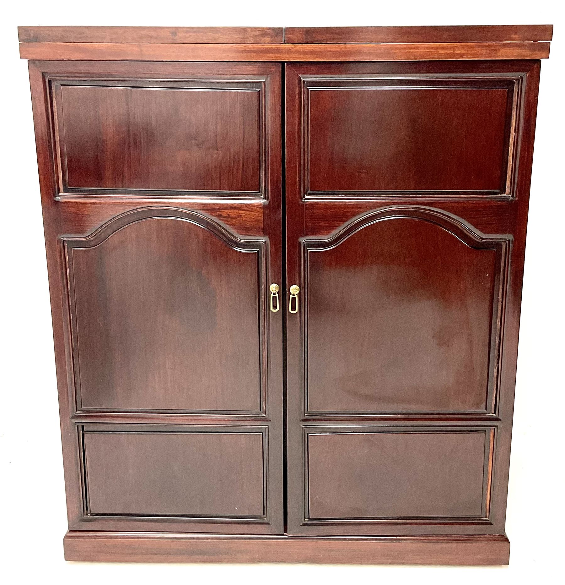 Chinese rosewood cocktail bar, hinge folding top, above two cupboard doors enclosing fitted interior, platform base