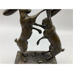 Bronze figure group, modelled as two male hares boxing, upon a naturalistic base after 'Nick' and with foundry mark, raised upon a rectangular base, H24cm