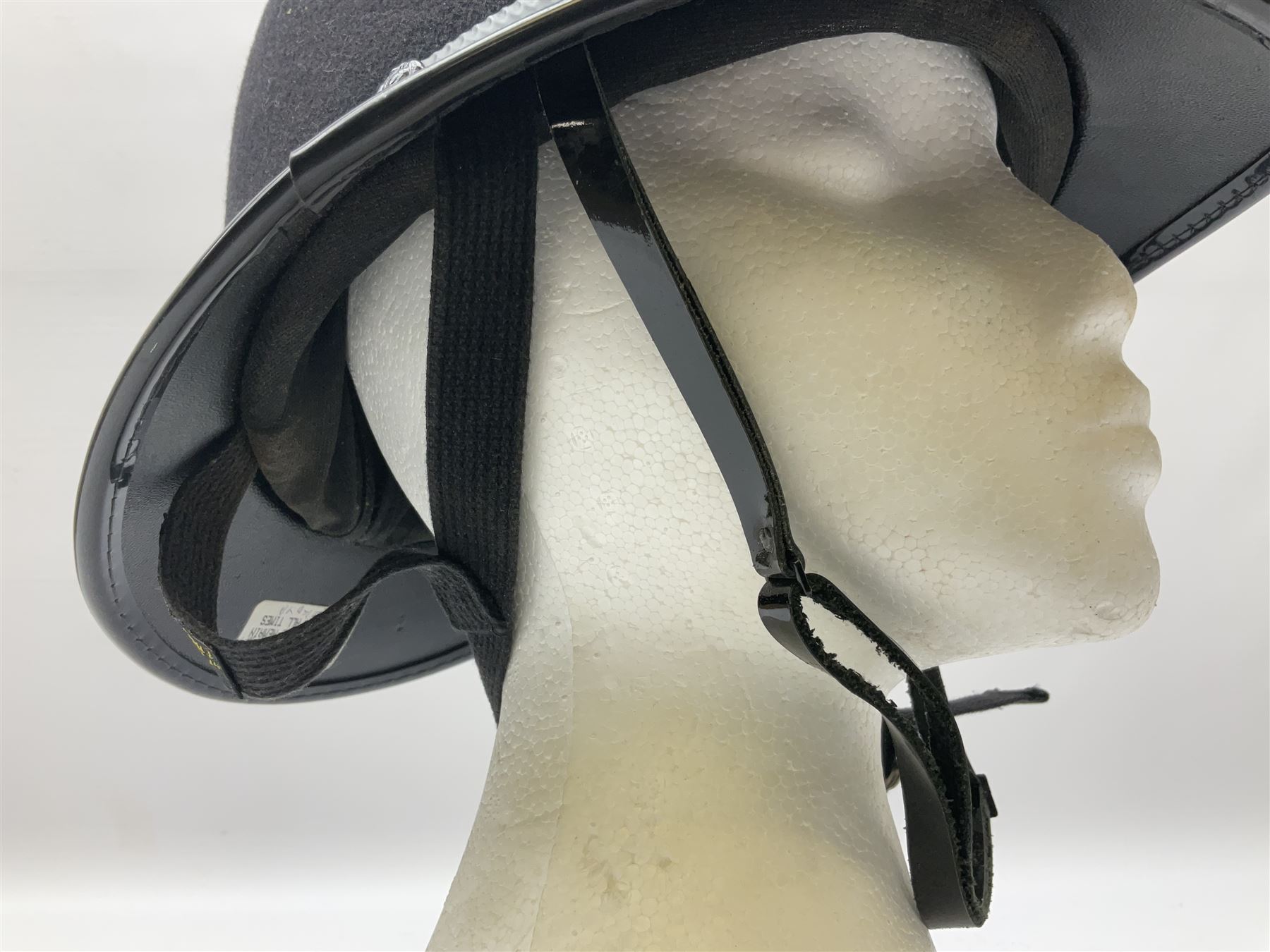 British Transport Police Custodian helmet with Queen's Crown plate; Hiatt & Co ebonised hardwood patrol truncheon; and pair of Hiatts 1960 hand-cuffs (3)