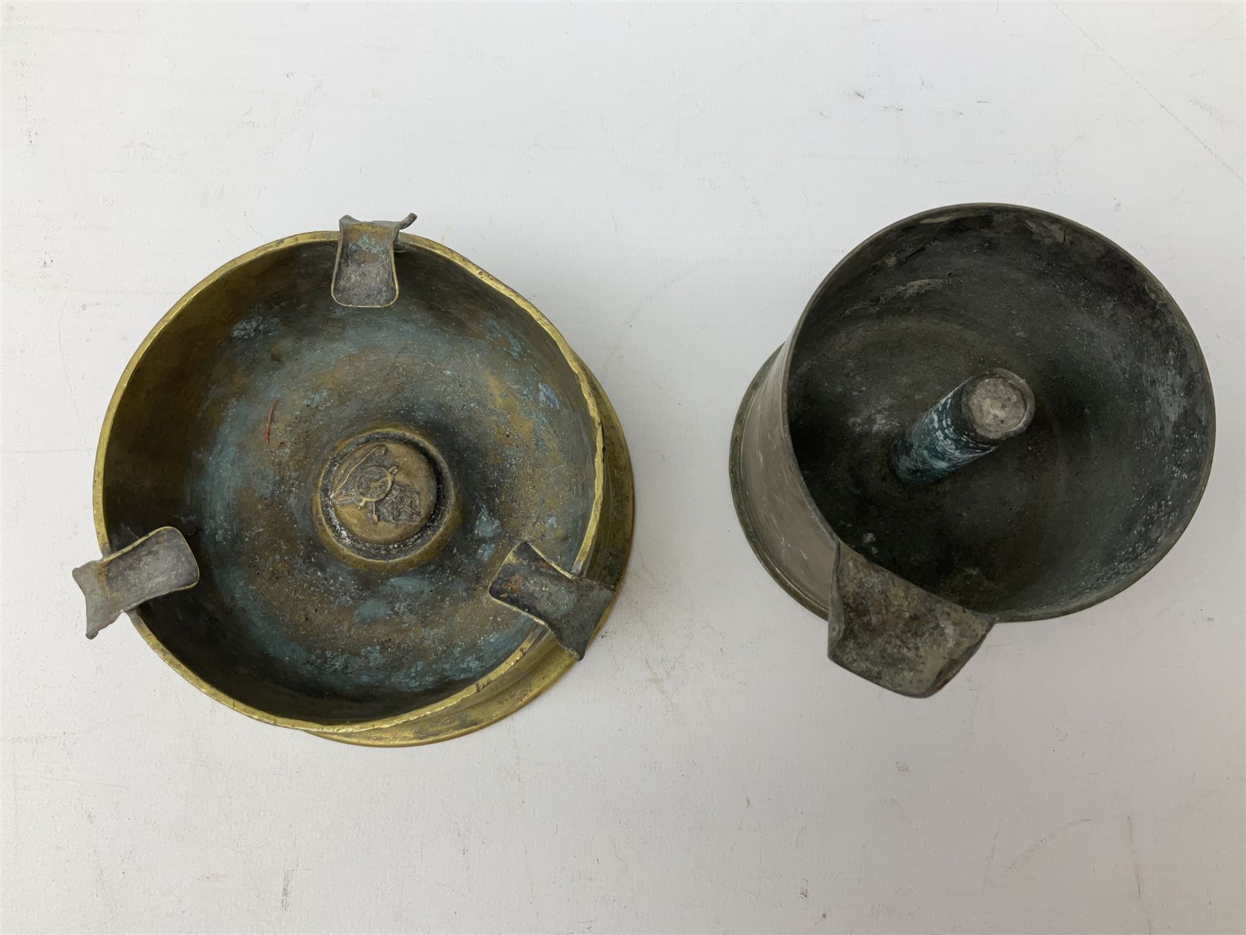 Trench Art - three WW2 brass shell case ashtrays, one mounted with Royal Artillery cap badge and button and one mounted with RA button; together with a pair of place name holders each formed from a Royal Artillery cap badge (5)