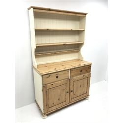 *Painted and pine dresser, raised three tier plate rack, two drawers above two cupboards, bun feet, W110cm, H179cm, D45cm
