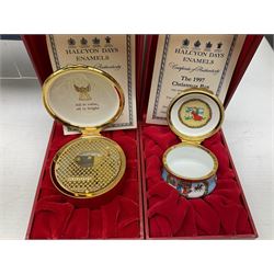 Eight Christmas themed Halcyon Days enamel boxes, and a Halcyon Days enamel bonbonniere modelled as a snowman, each in fitted box 