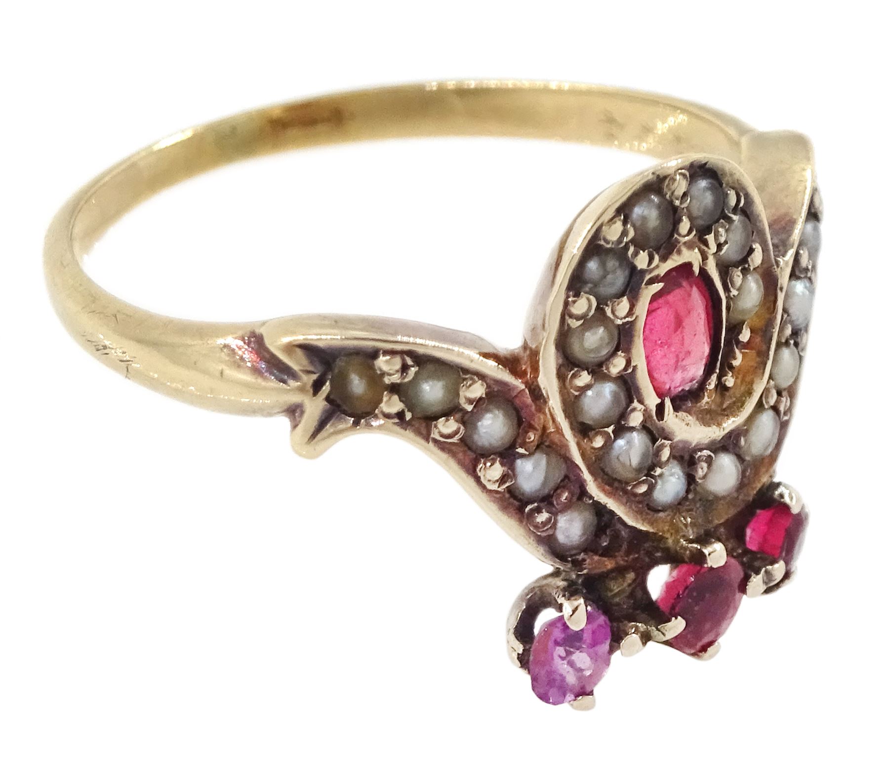 Victorian 9ct rose gold red paste and seed pearl ring, oval paste stone within a scrolling border of seed pearls, surmounted with round cut red paste stones