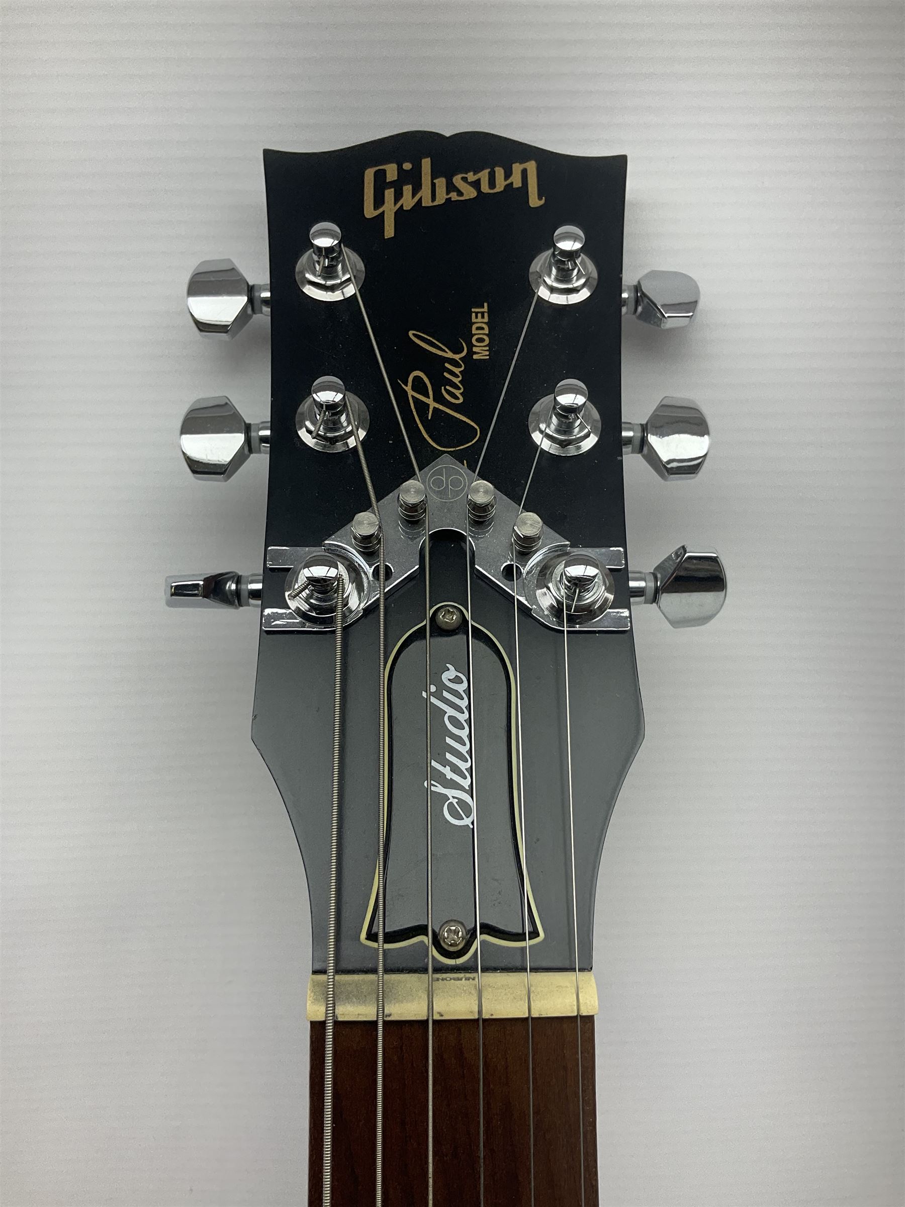 2012 American Gibson Les Paul Studio electric guitar, retro fitted with iron gear pick-ups, push-pull 'pots', roller bridge, string butler and locking machines, serial no.115321594, L99cm overall; in Gibson soft carrying case.