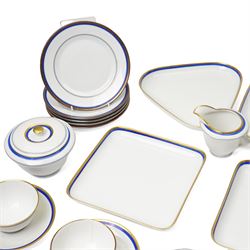 Royal Copenhagen mid-20th century tea service decorated in blue and gilt comprising ten teacups, ten saucers, ten side plates, two triangular serving plates, two square serving plates, teapot, milk jug and covered sucrier 