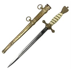 WW2 German kreigsmarine style dagger composed from various age parts, the post-war 25cm double fullered blade  with etched decoration and inscribed WKC with knight's head; in gilt brass scabbard with two rings L42cm overall