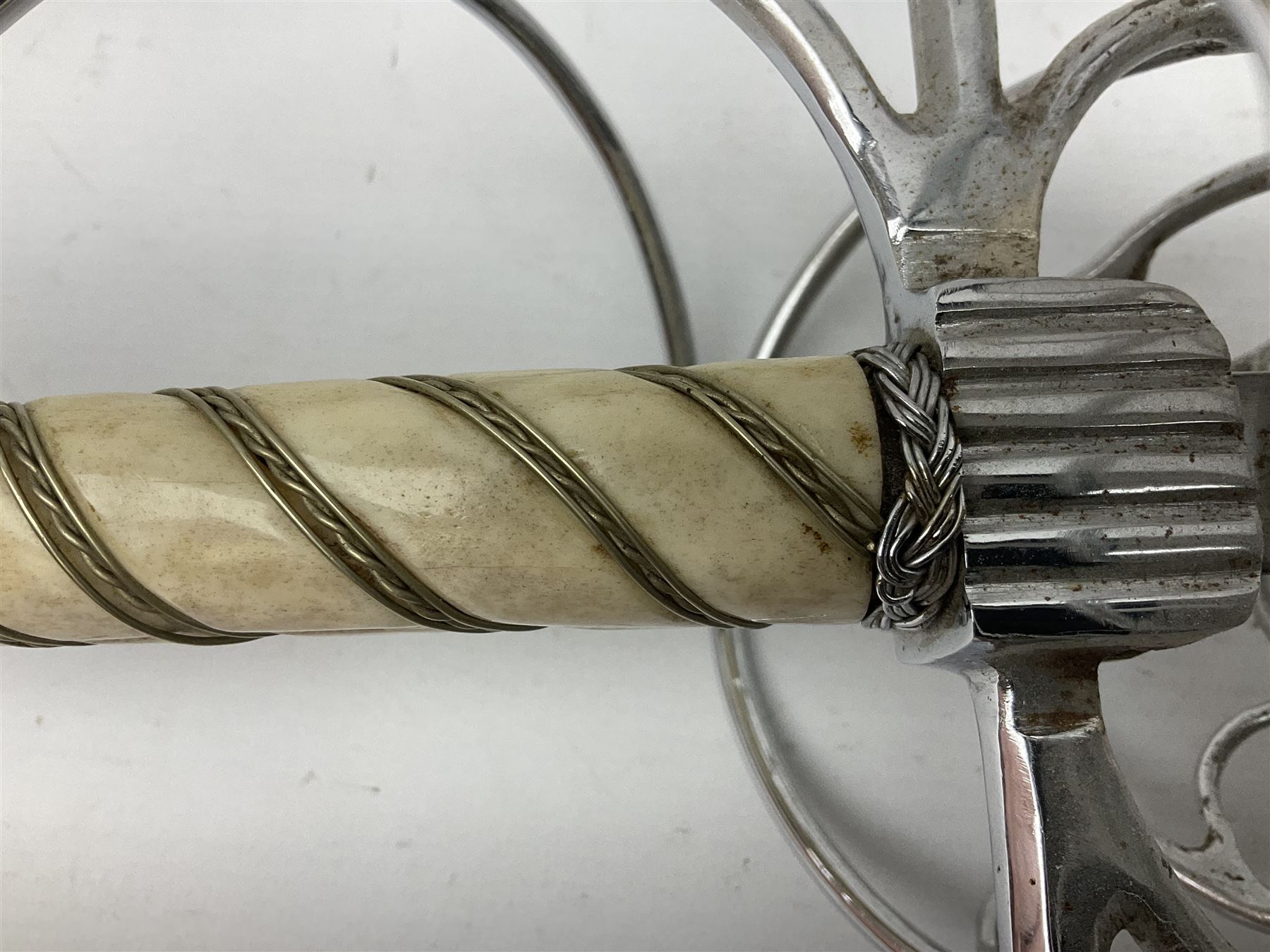 Replica knight's longsword, the 91.5cm double-edged steel blade with basket hilt and wire-bound bone grip with spherical pommel, in leather scabbard L112cm overall