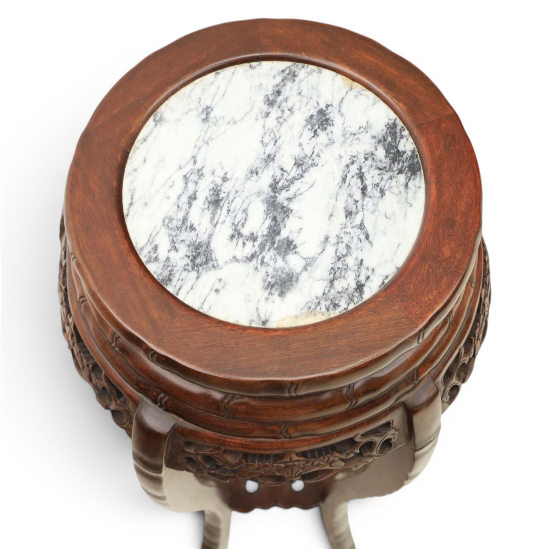 Chinese hardwood jardiniere stand, with inset black veined white marble, pierced carved apron united by rose carved undertier