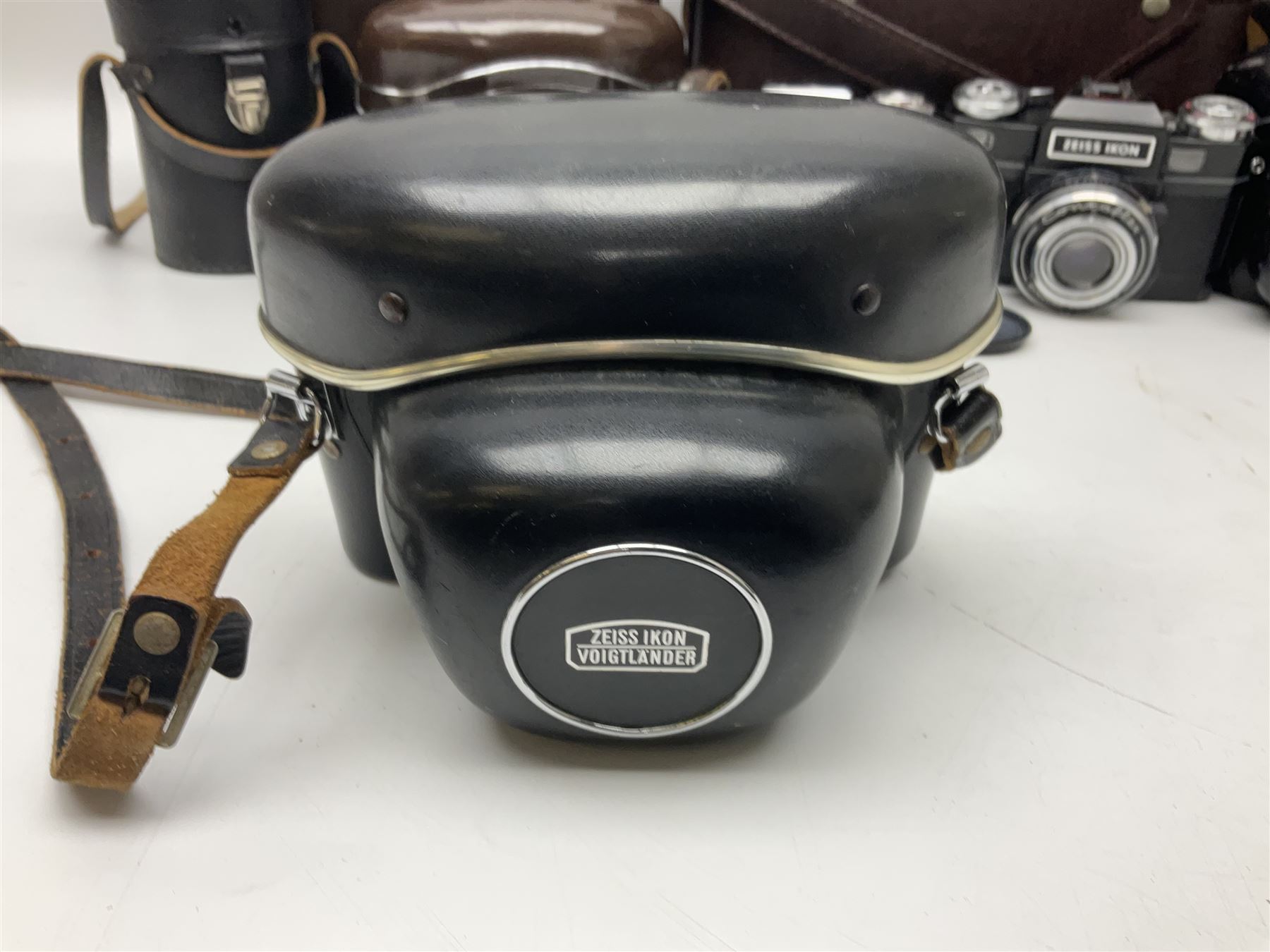 Four Zeiss Ikon camera bodies, to include, Contaflex Super B camera body, serial no. B31591, with 'Carl Zeiss Tessar 2.8/50 lens, serial no.3425553, Contaflex Super BC camera body, serial no. P81728, with 'Carl Zeiss Tessar 2.8/50' lens, serial no 4822280, etc, together with three cased lenses; 'Carl Zeiss Pro-Tessar 1:4 f=115mm' lens, serial no 3734740, 'Carl Zeiss Pr-Tessar 1:3.2 f=85mm' lens, serial no. 3647764 and 'Carl Zeiss Pr-Tessar 1:3.2 f=35mm' lens, and other Zeiss Ikon equipment 