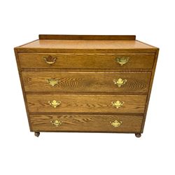 Mid-20th century oak chest, raised back, fitted with four graduating drawers, on castors