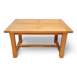 Light oak extending dining table, rectangular top with two additional leaves, on square ch...