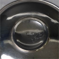 German silver cup and saucer, both with engraved foliate decoration, stamped 800, the saucer with crescent and crown mark