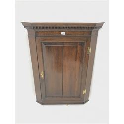 19th century oak wall hanging corner cupboard, projecting cornice with dentil frieze, single door enclosing two shaped shelves