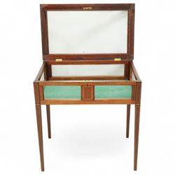 Edwardian satinwood and inlaid bijouterie table, rectangular hinged glazed top above a baize-lined interior, frieze with panelled inlay detail, raised on square tapered legs with boxwood and ebony stringing