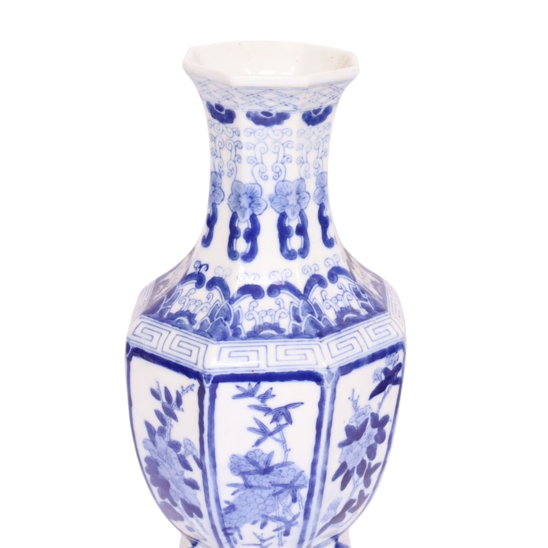 Pair of blue and white vases, of octagonal form, decorated with panels of blossoming branches, H36cm