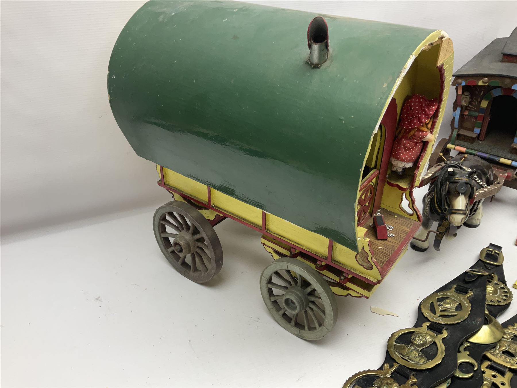 Two ceramic shire horse and gypsy caravans, together with horse brasses 
