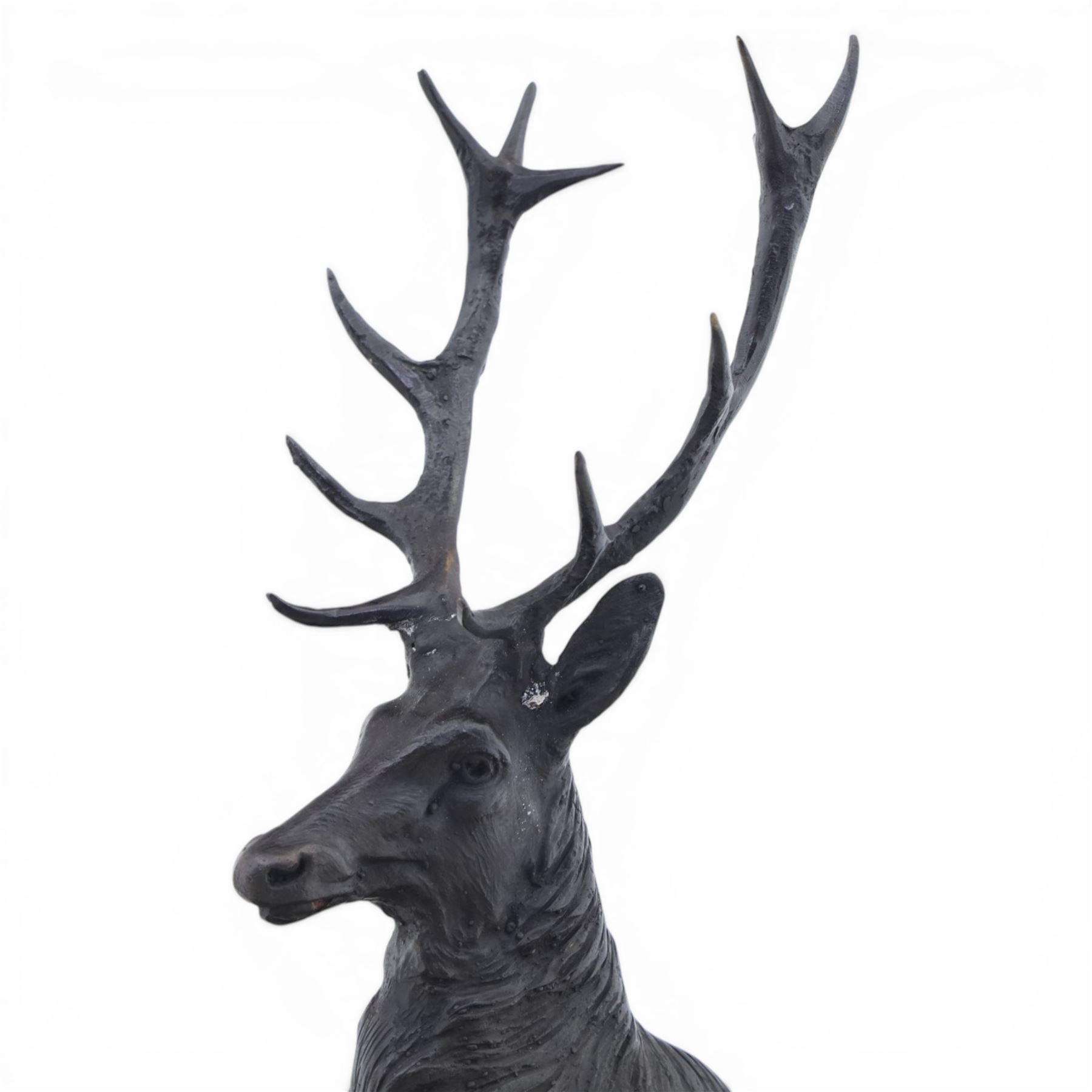 Pair of bronze stags, after Jules Moigniez, modelled in alert stance upon naturalistic bases, set on oval marble plinths, signed to base
