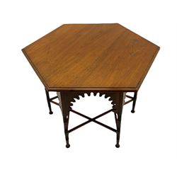 Liberty & Co circa 1890 - walnut centre table, hexagonal form, fretwork frieze, star stretcher base, turned supports on button feet. Stamped on underside.
Featured in - Pictorial Dictionary of British 19th century Furniture Design, Daryl Bennett Liberty's Furniture, 1875-1915, The Birth of Modern Design.
Liberty Style, The Classic Years, 1898 - 1910, by Mervin Levy.