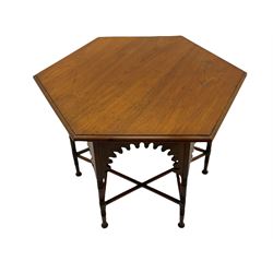 Liberty & Co circa 1890 - walnut centre table, hexagonal form, fretwork frieze, star stretcher base, turned supports on button feet. Stamped on underside.
Featured in - Pictorial Dictionary of British 19th century Furniture Design, Daryl Bennett Liberty's Furniture, 1875-1915, The Birth of Modern Design.
Liberty Style, The Classic Years, 1898 - 1910, by Mervin Levy.