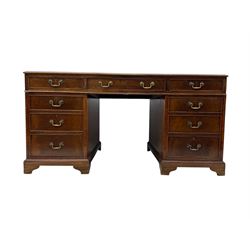 Edwardian mahogany twin pedestal desk, rectangular burgundy leather top moulded edge, over three short drawers with brass swan neck handles, over twin pedestals with graduating drawers supported on bracket feet