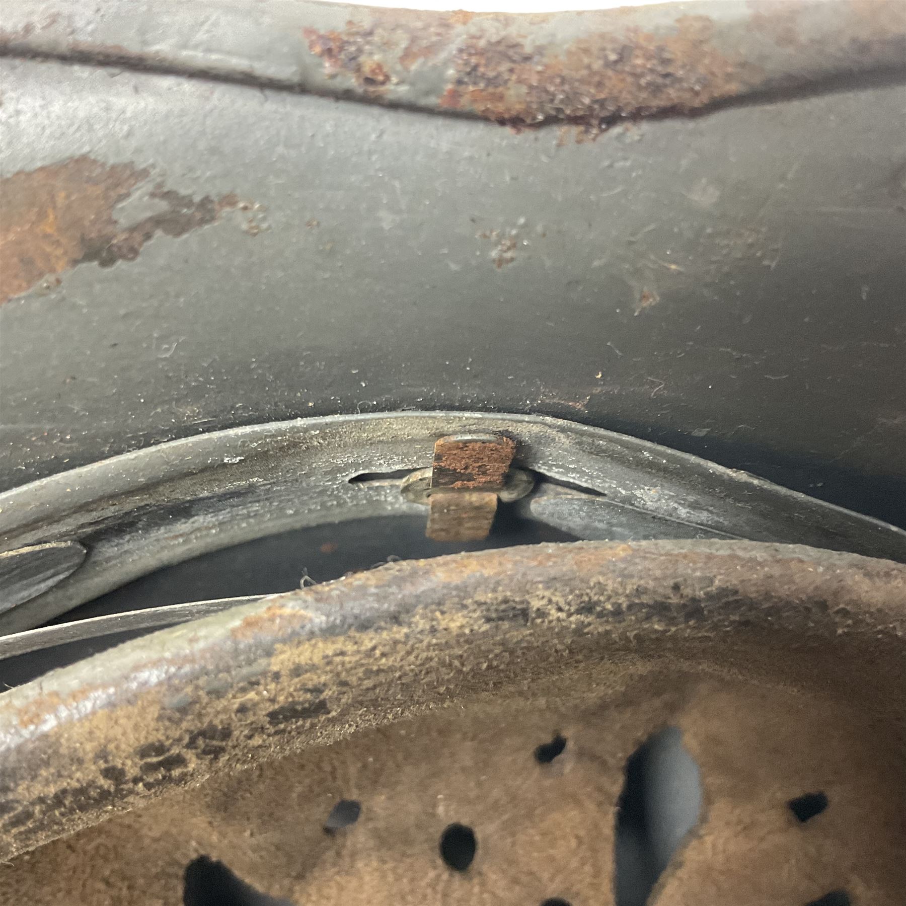 WW2 German Infantry M40 steel helmet with tropical finish and traces of single decal; with chin strap and leather liner marked 57 twice in red; back apron stamped 11 38