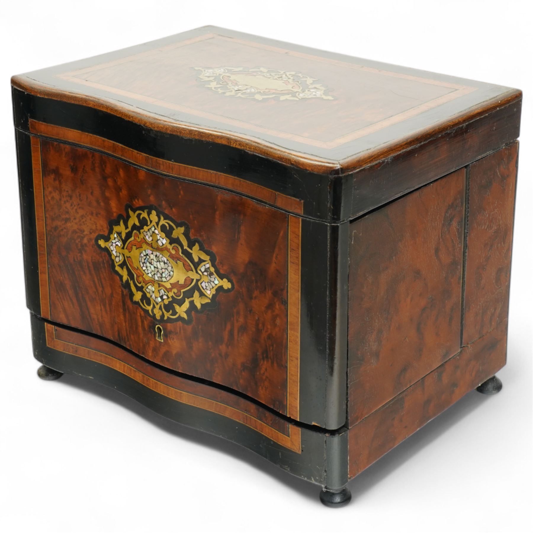 19th century French Boulle-style cave à liqueur or travelling decanter set, with musical mechanism playing carrara bonne de ay and Locked in the old Kent Road, the walnut box of serpentine front, the hinged lid with central brass and mother of pearl cartouche, with removable wooden tiered tray with gilt metal handle, containing four foliate etched glass decanters and sixteen glasses, H27cm