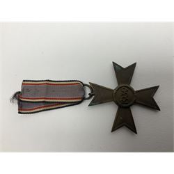 Five WW2 German medals/badges -German Defences West Wall Medal, War merit Cross, Red Cross Decoration, RAD tinnie brooch and Adolf Hitler 1934 medallion (5)