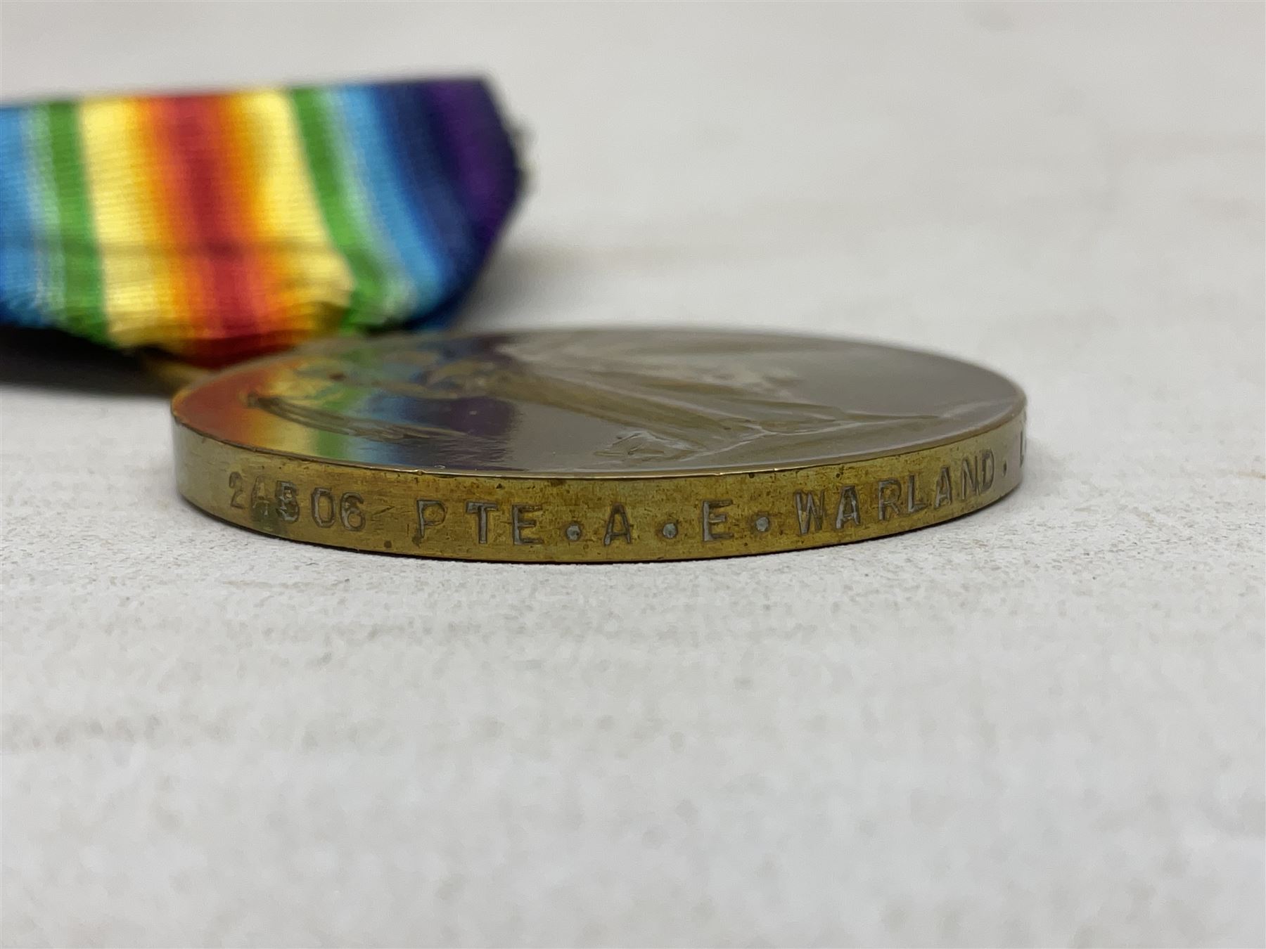 Two WW1 pairs of medals comprising British War Medal and Victory Medal awarded to 24506 Pte. A.E. Warland L.N. Lan. R.; and 1914-15 Star and Victory Medal to 12803 Cpl. J. Evans Devon R.; all with ribbons (4)