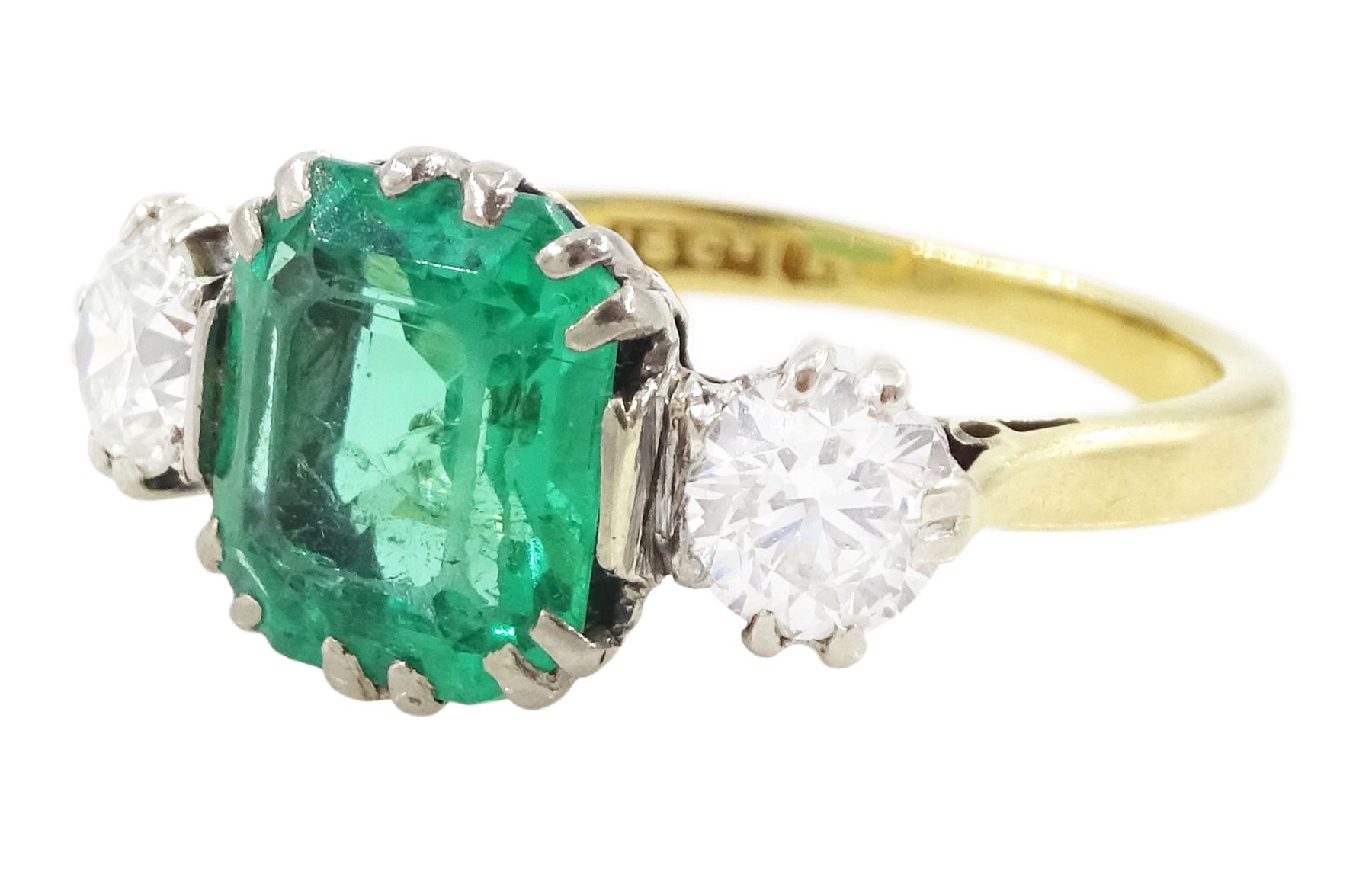 Early 20th century gold three stone transitional cut diamond and octagonal cut emerald ring, stamped 18ct, emerald approx 1.65 carat, total diamond weight approx 0.50 carat