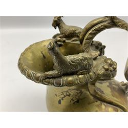 19th century Grand Tour bronze askos wine pitcher, of typical form with putto mounted scrolling foliate handle and two recumbent goats to the rim, H17cm W16cm