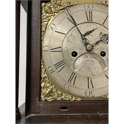 Thomas Hutchinson of Leeds - 18th century 8-day oak longcase clock with as broken arched  pediment and moulded cornice, with a conforming hood door flanked by plain turned pilasters with gesso capitals,  long trunk door with a wavy top on a square plinth with a raised panel, brass dial with cast spandrels,  engraved silvered dial centre and chapter ring with Roman numerals, five minute Arabic's and minute track, with pierced steel hands, seconds pointer,  arched calendar aperture and silvered boss engraved with the makers name to the break arch, dial pinned to a rack striking two train movement with a recoil anchor escapement. With weights and pendulum. Thomas Hutchinson is recorded as working in Leeds from 1760-90.