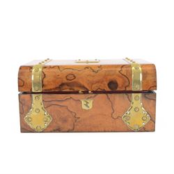 19th century walnut and brass bound games compendium box, painted to enhance the grain, of rectangular form, the hinged opening cover with rounded sides, central brass cartouche with engraved lion crest, and brass riveted straps, opening to reveal a red leather and blue silk lined compartmented interior, with fold-down games board, and lift-out tray containing playing cards, ebony turned dice towers, white and red stained bone draughts, and chess pieces, ivory dice, and ivory and ebony whist markers, and brass bezique board, cribbage board and markers, H15cm W32cm D24cm
This lot has been registered for sale under Section 10 of the APHA Ivory Act