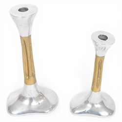 Set of David Marshall graduating candlesticks, brass and polished aluminium, makers mark impressed to stem, largest H26cm