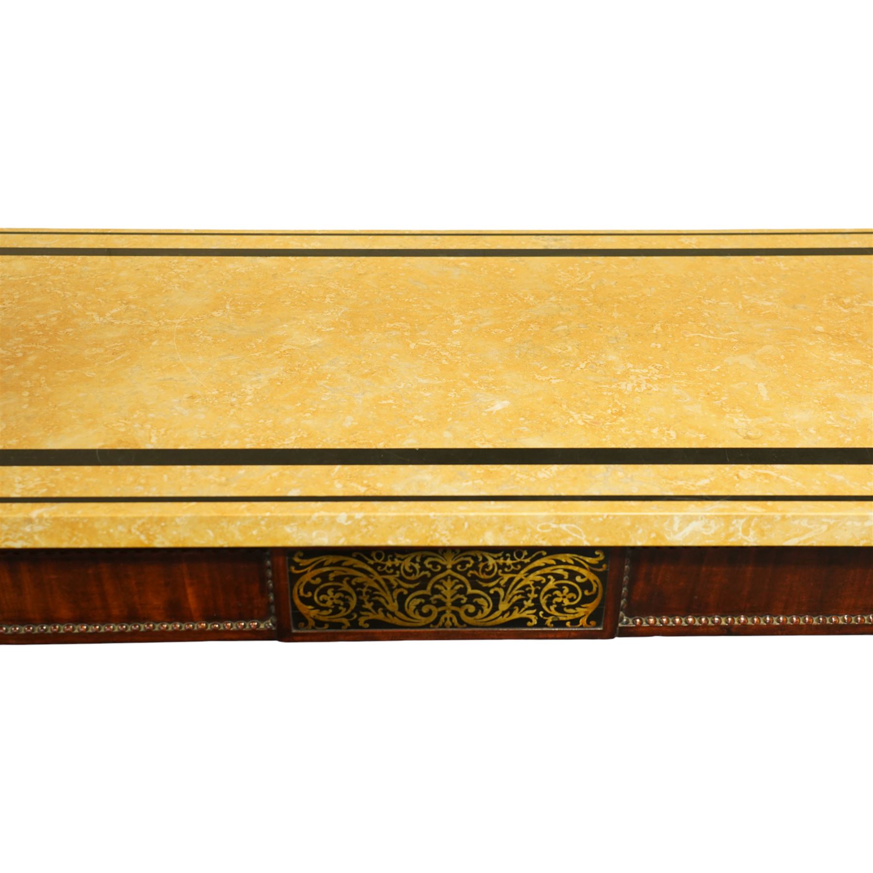 William IV mahogany and brass-inlaid marble serving table, the rectangular marble top featuring yellow tones, bordered by inlaid coloured marble bands in red and black, the frieze with brass-inlaid Boulle-inspired foliate panels on ebony, lower edge with beaded moulding, front legs inlaid with a stripped band of coromandel above carved acanthus leaves, tapering to carved lion paw feet, circa 1830