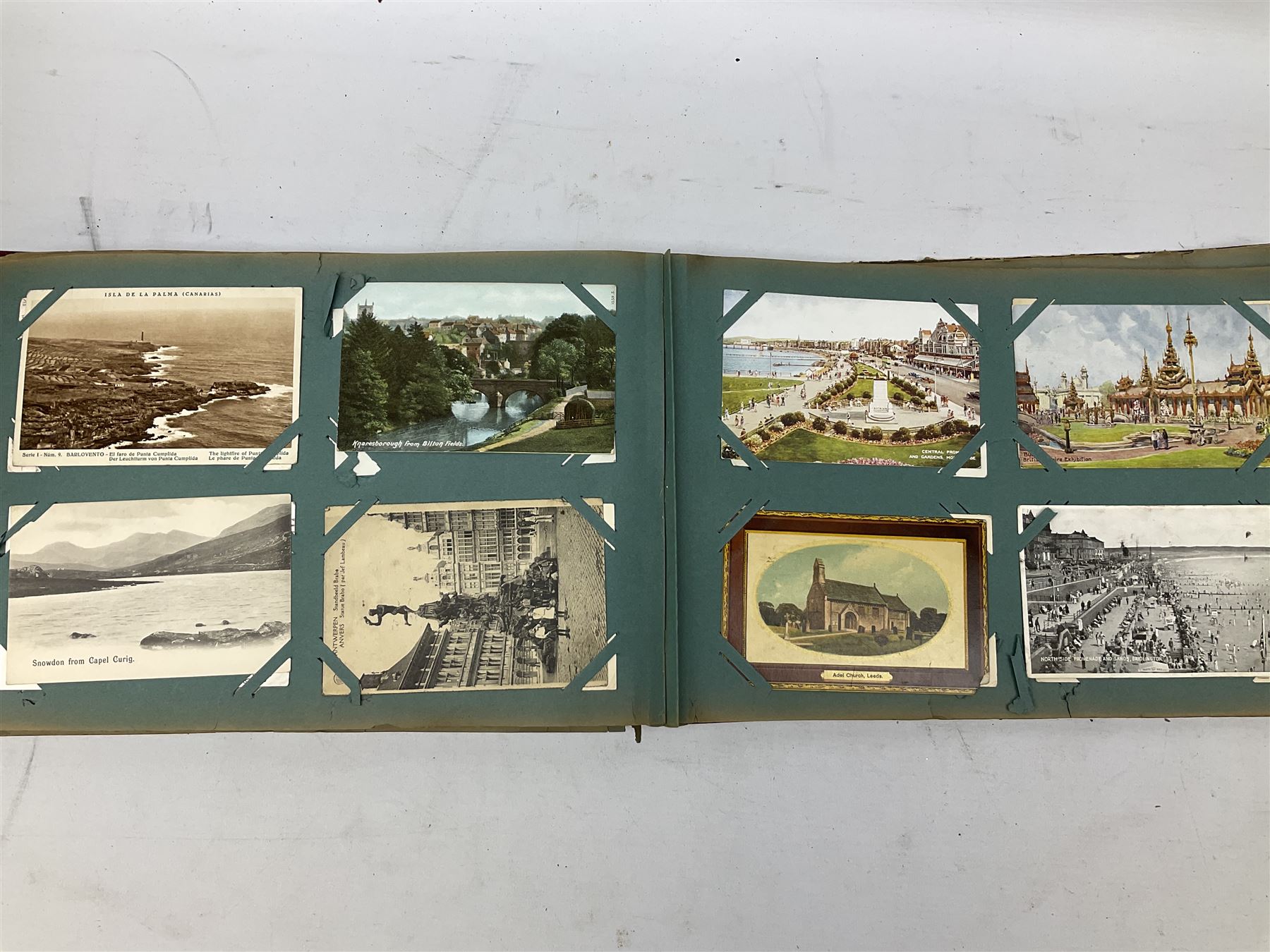 Album containing approximately four hundred Edwardian and later postcards including three Louis Wain, comic cards by Tom Browne, Phil May etc, British and Foreign topographical including real photographic and local, Coronation trams, actresses etc; and large quantity of loose postcards including WW1 Belgium views and caricatures, Royalty portraits etc, 