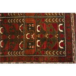 Baluchi hand-knotted prayer rug, dark brown ground divided into six panels decorated with stylised tree-of-life and flowering motifs in madder red and ivory, enclosed by multiple narrow geometric borders, with fringed ends