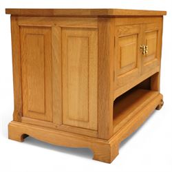 Unicornman - Yorkshire oak media cabinet, rectangular top over a pair of panelled cupboard doors with brass handles, open undertier, on shaped bracket supports above castors