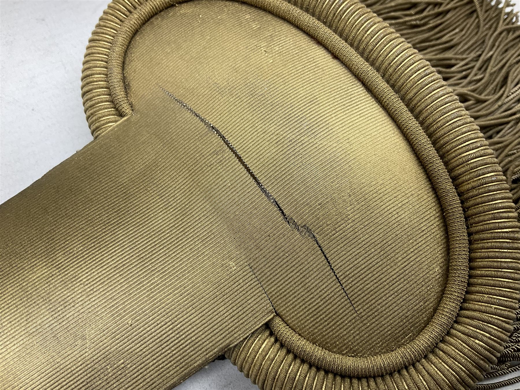 WW1 French pair of Coloniale Artillerie Epaulettes, plain gold colour, one with tassels; in open box bearing Ecole Saint Cyr label; together with WW2 French Artillery Officer's greatcoat; bears label 'P. Vauclair 40 Boul. du Montparnasse Paris (inscribed to) Mr. Babin Le 17/4/40 No.674' (2)