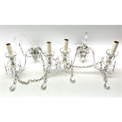 Pair of glass wall sconces, with central curved branch, and two further branches leading to glass sockets and drip pans, each supporting cut glass drops, H25cm L33cm D26cm